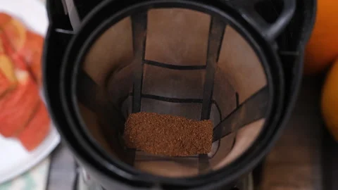 Close-up of ground coffee pouring into filter Stock Footage 321952675
