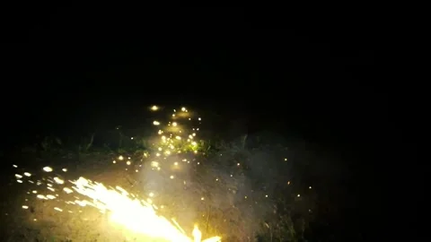 Close-up of a Ground Firecracker Ignition and Sparks. Nighttime Firecracker Vídeos de archivo 308387658