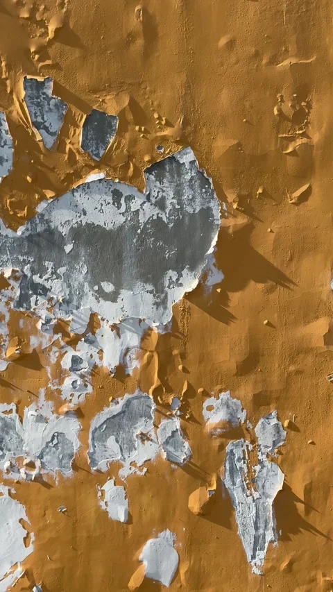 Close ground level shot focusing on cracked paint texture and worn exterior Stock-Footage 332586499