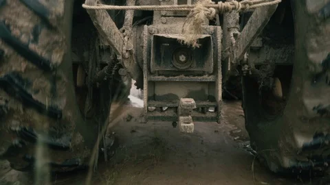 Close on ground under a tractor of grass and wheels in Myanmar Video stock 95620597