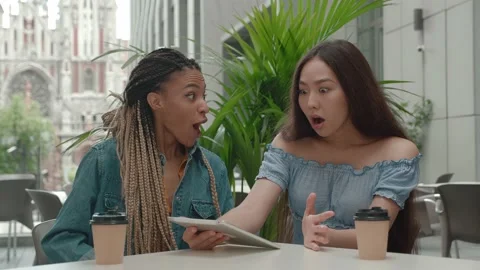 Close-up. group of 2 people. two student partners are working on a tablet , an Stock Footage 165691329