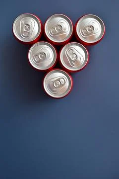 Close up group of aluminium red cans soft drink put on blue texture backgroun Stock Photos