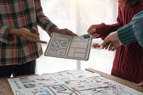 Close up group of asian creative team programing designers participate in all Stock Photos