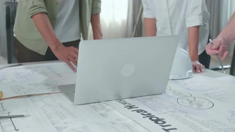 Close Up Of Group Of Asian Engineers Discuss About Work On Laptop At The Office Stock Footage 172416973