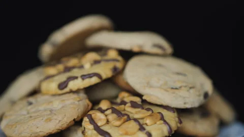 Close-up of Group of Assorted Cookies. Chocolate Chip, Oatmeal Raisin, Whit.. Stock Footage 328352788