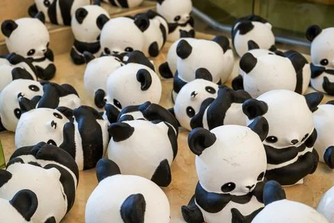 Close-up of a group of ceramic graffiti panda dolls Foto stock