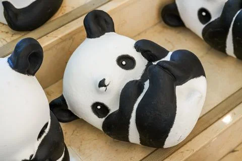 Close-up of a group of ceramic graffiti panda dolls Foto stock