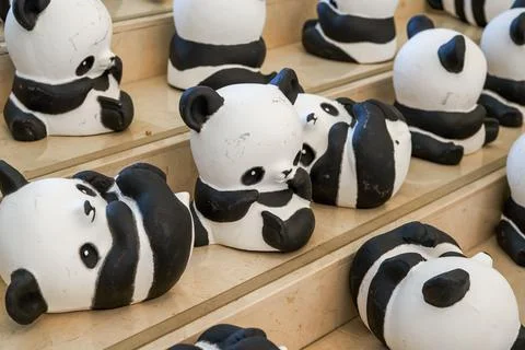 Close-up of a group of ceramic graffiti panda dolls Foto stock