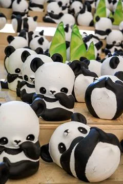 Close-up of a group of ceramic graffiti panda dolls Foto stock