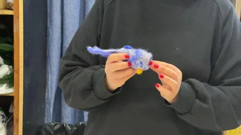 Close-up of a group of children making a toy out of wool, hands-on view, childre Stock Footage 306540724