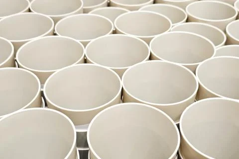 Close up of a group of cups arranged in a grid pattern. Stock Photos