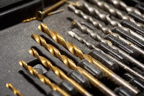Close-up of a group of drill bits for drilling holes. Фото