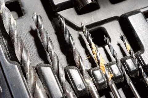 Close-up of a group of drill bits for drilling holes. Stock Photos