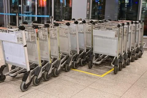 Close up group of empty airport carts baggage carts, luggage carts, luggage t Stock Photos