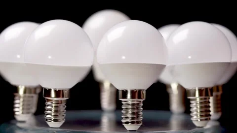 Close-up of a group of LED light bulbs on a black background Stock Footage 327370055