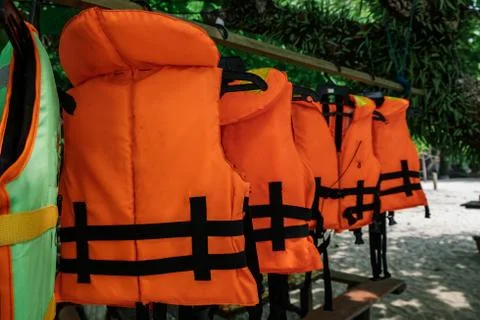 Close-up group of Life jacket or life vest hanging under the shelter at Pangk Foto stock