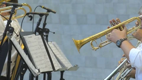 Close up of a group of men playing on trambones on the stage. 4k close up Video stock 77569489