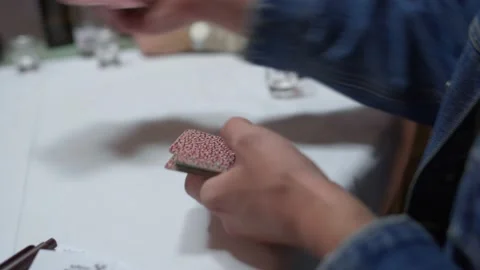 Close up of a group of men playing a tyrolean card game.  Close up of Stock Footage 220942279