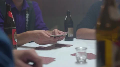 Close up of a group of men playing a tyrolean card game with hands Stock Footage 221031481
