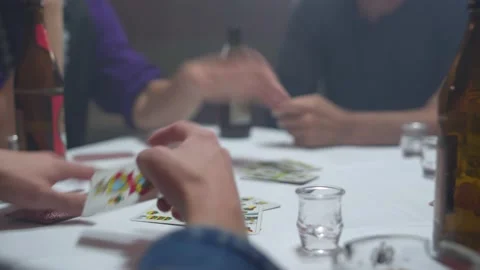 Close up of a group of men playing a tyrolean card game. Person with cards Stock Footage 221031484