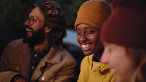 Close up group multi-ethnic young people enjoying at outdoor winter night Stock Footage 253438038
