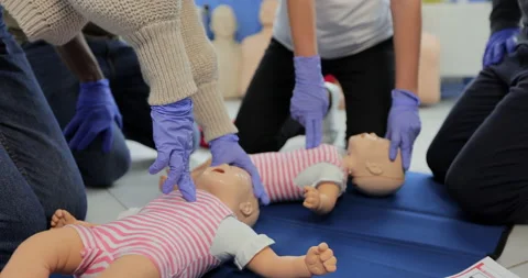 Close up of group of multiethnic people during the first aid training with Stock Footage 163978189
