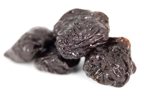 Close up group of prunes on white background Stock Photos