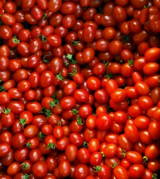 Close up group of red tomatoes on ground use for beautiful background colorfu Stock-Fotos