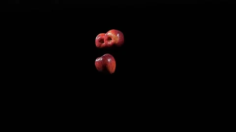 Close up at the group of three apples fly up and spinning in slow motion Stock Footage 152789534