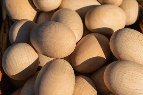 Close-up of a group of wooden Easter eggs for self-dyeing in natural sunlight Stock Photos