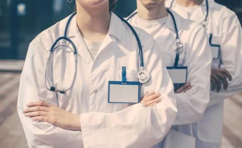 Close up. a group of young doctors standing in a row. Stock Photos