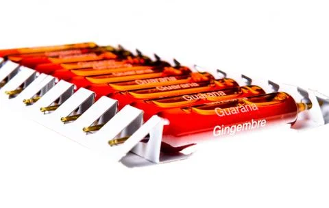 Close up of guarana, ginseng and ginger ampuls Stock Photos