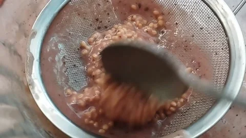 Close-Up of Guava Seeds on Strainer After Juicing Stock Footage 229199929