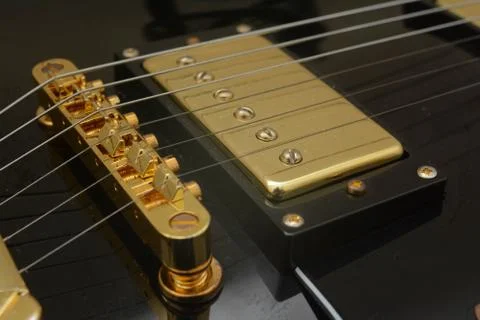 Close up guitar bridge, string and pickups. Stock Photos