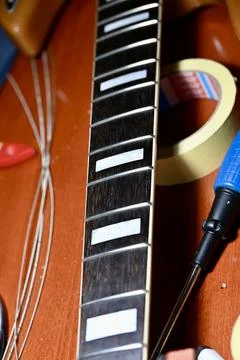 Close-up of Guitar Fretboard with Rectangular Inlays Stock Photos