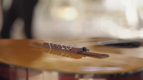 Close-up of a guitar lying next to the stage before the start of the concert Stock Footage 156725872