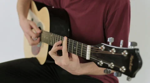 Close up of a guitar playing Stock Footage 48056416
