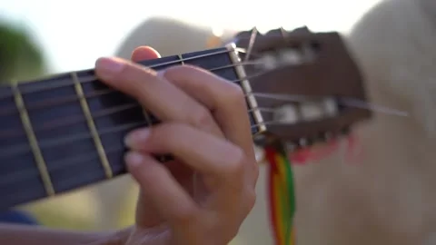 Close up of guitar playing hand with sunlight Video stock 231207948