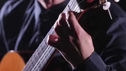 Close-up of guitar strings and fretboard,man playing an acoustic guitar,isolated Stock Footage 121583916