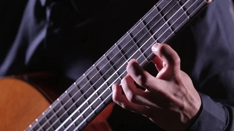 Close-up of guitar strings and fretboard,man playing an acoustic guitar,isolated Stock Footage 121584265