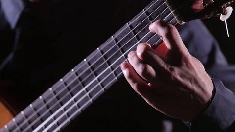 Close-up of guitar strings and fretboard,man playing an acoustic guitar,isolated Stock Footage 121584463