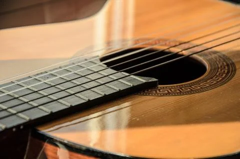 Close-up of guitar strings in sunlight. Stock Photos
