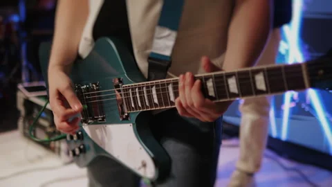 Close-up of a guitarists hands with a guitar. Stock Footage 295402235