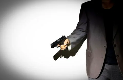 Close up gunman on dark background Stock Photos