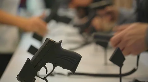 Close-Up of Guns on Display. Black Cold Metal. the Instrument of Self-Defense Stock Footage 68605782