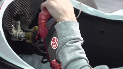 Close up of guy driving a simulator in a real race car  Stock Footage 106496365