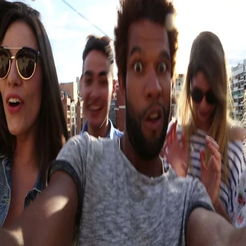 Close up of guy filming himself and friends at rooftop party Stock Footage 69300964