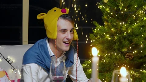 Close-up of a guy looking at the camera for the New Year. Stock Footage 220078387