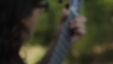 Close Up On Guy Playing Guitar Strings Stock Footage 125963834