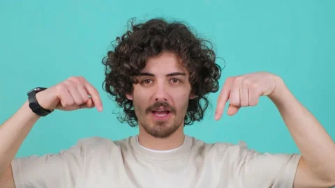 Close up of a guy pointing down, saying to subscribe, gesturing ok and like. Stock Footage 156338031